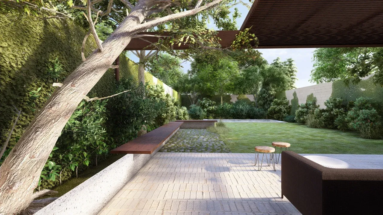 Vista del paisajismo de terraza remodelada en Las Condes, con banca flotante de metal, adoquines y pérgola de madera